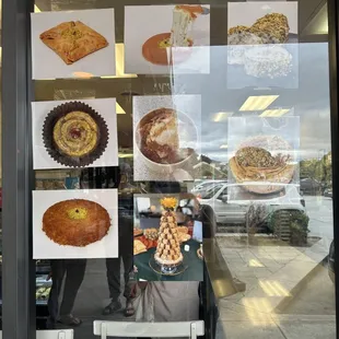 a window display of pastries and pies