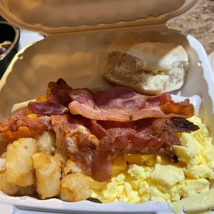 bacon and eggs in a styrofoam container