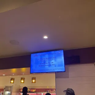 the menu on the screen above the counter
