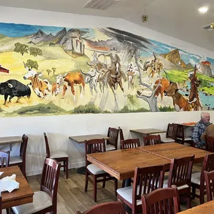 a man sitting at a table in a restaurant