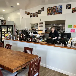 a woman preparing food in a restaurant