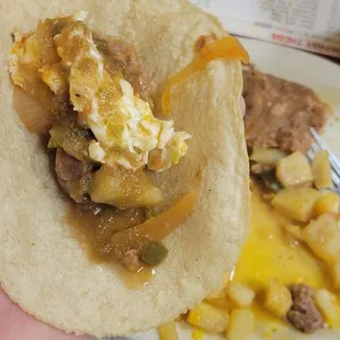 Juevos rancheros con guisada y tortilla de maiz.  $8.95