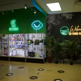 Oasis Dispensary - In house brands (PUF, City Trees, &amp; Naked City). Featured brands display cases &amp; photo booth!