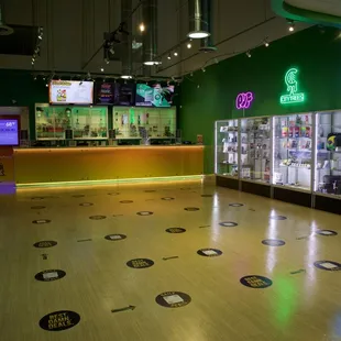 Oasis Dispensary - In house brands (PUF, City Trees, &amp; Naked City). Featured brands display cases.