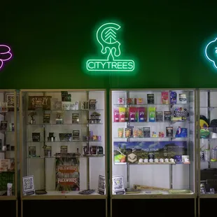 Oasis Dispensary - House brands (PUF, City Trees, &amp; Naked City) &amp; featured brand display cases.