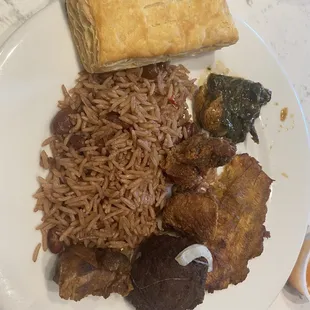 Fried Plantain, griot, meatball, Lalo, and rice and beans.