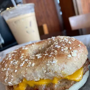 a bagel sandwich with cheese and mustard