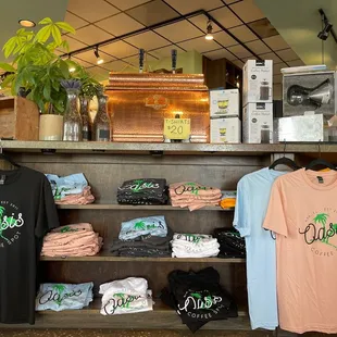 a variety of t - shirts on display