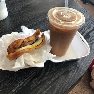Iced almond milk latte with a ham, egg and cheese croissant.