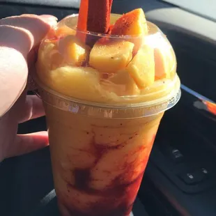 Mangonada- Blended mango, mango chunks , chamoy and Tajin w/ a tamarind candy stick