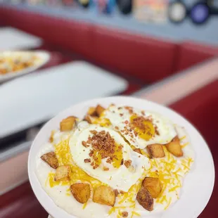 a person holding a plate of food