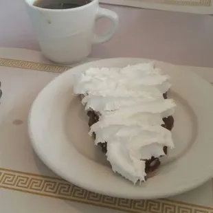 a plate of cake and a cup of coffee