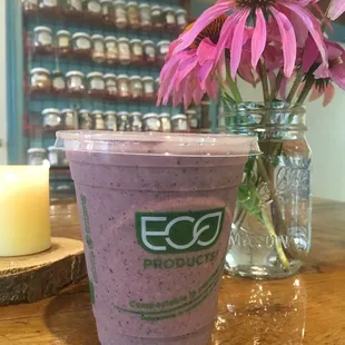 The Oasis Smoothie- Organic Pineapple, Blueberry, Banaba, and Strawberry with Coconut Milk, Seasonal Greens, and Hemp Hearts.