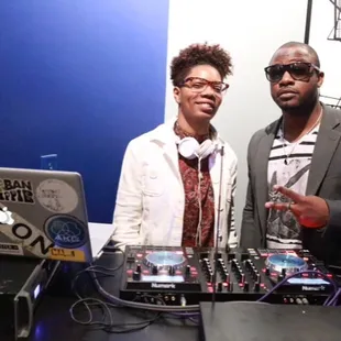 two djs posing for a picture