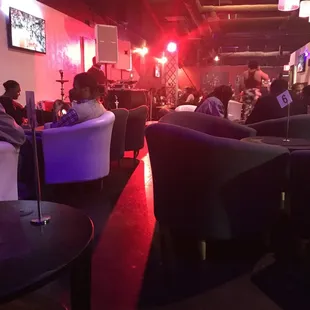 a group of people sitting in lounge chairs