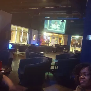 a group of people in a lounge area