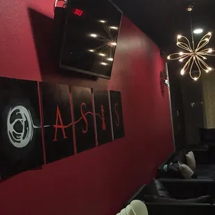 a red wall with black and white signs