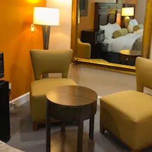 MH OasisInnSuites Ridgecrest CA Guestroom TwoQueenSofa