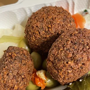 a close up of a meal in a styrofoam container