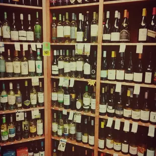 a large selection of wine bottles