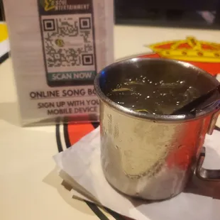 a cup of hot chocolate with a qr code on the side