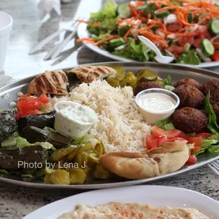 Part of #54 Vegetarian Feast for 4-5 people ($45) - hummus, baba ghanouj, falafel, pita spinach pie, mujadara, vegetarian grape leaves