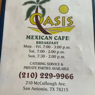 a hand holding a menu