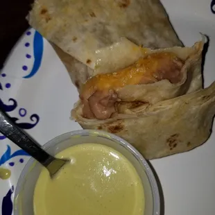 Bean and cheese burrito. Amazing green sauce.