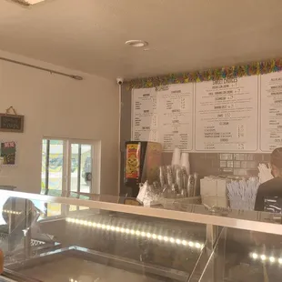 a woman standing in front of a counter