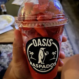 Strawberry raspado with one scoop of chocolate chip ice cream