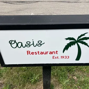 a sign for oasis restaurant
