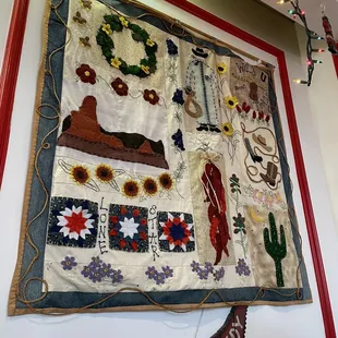 a picture of a wall hanging with a variety of items