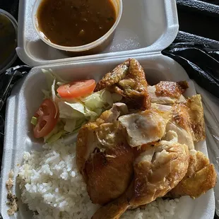 1/2 chicken with rice and beans and a small salad