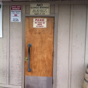 a closed door and a no smoking sign