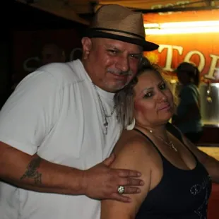 a man and a woman posing for a picture