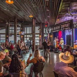 a crowd of people sitting at tables