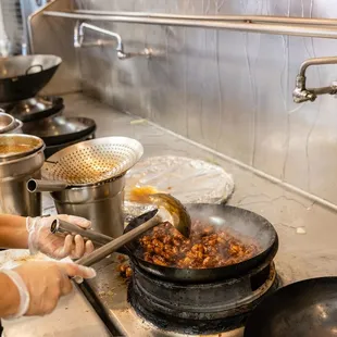 a woman preparing food in a kitchen