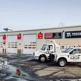 a truck parked in front of a building