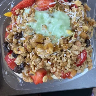 a bowl of fruit and granola