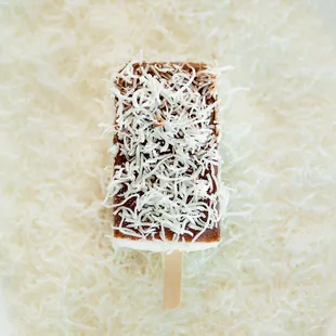Coconut Eskimo with chocolate and shaved coconut.