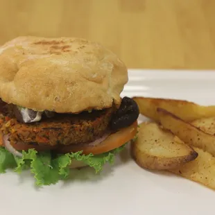 Oasis Burger with a side of potato wedges.