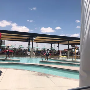 Lifeguards on duty while there is a break from swimming. They clear the pools at intervals for safety.