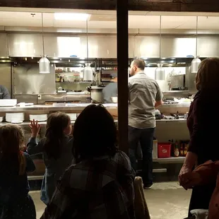 Amir holding court in the kitchen as we enjoyed our meal last Sat night.  He checked/prepped every single order that went out the door!