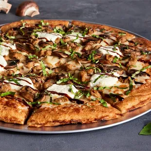 a pizza with mushrooms and cheese