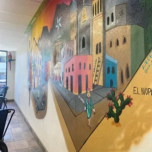 a mural on the wall of a mexican restaurant