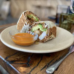 Burrito De Langostionos - Fried jumbo shrimp, avocado, rice, black beans, spicy salsa, flour tortilla