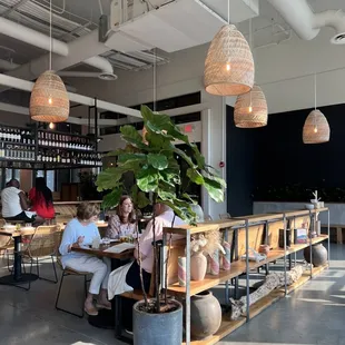 people sitting at tables in a restaurant