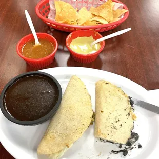 Huitlacoche and flor de calabaza quesadillas and black mole on the side.