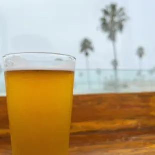 a glass of beer on a table