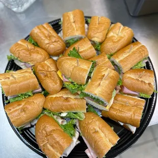 a plate of sandwiches on a table